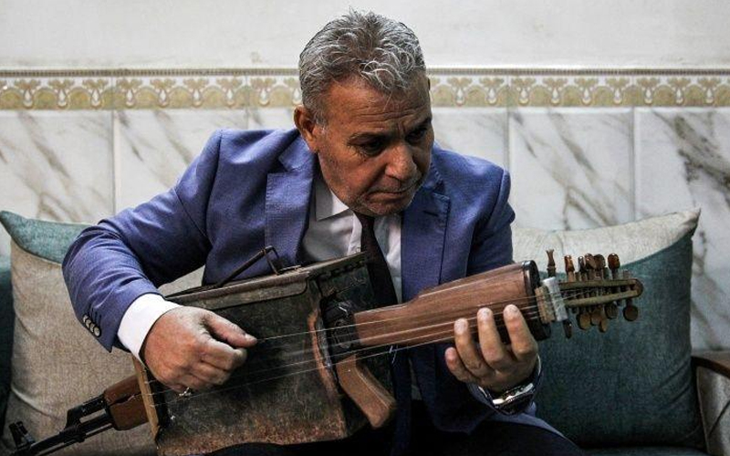 Iraqi transforms Kalashnikov into musical instrument