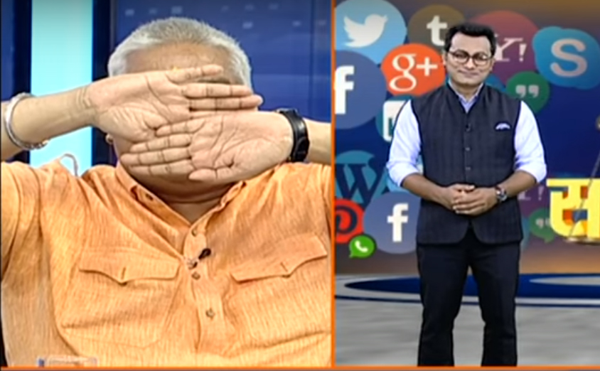 Ajay Gautam covers his eyes after seeing Muslim anchor