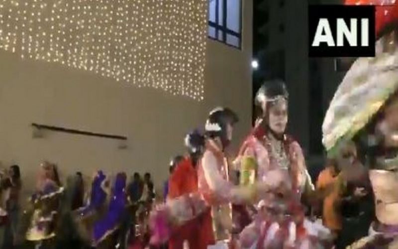 Dance group performs Garba wearing helmets to create road safety awareness