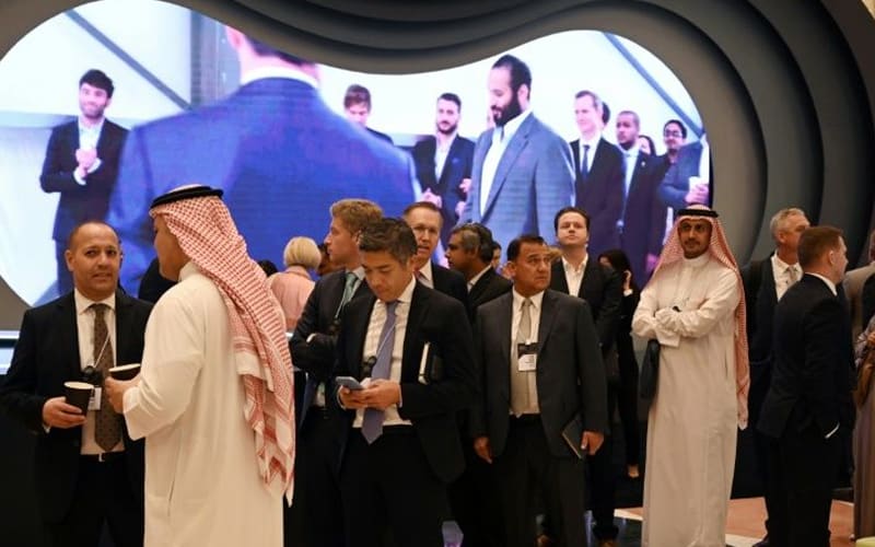 Saudi 'Davos in desert': Glitz, smiles, hidden name cards