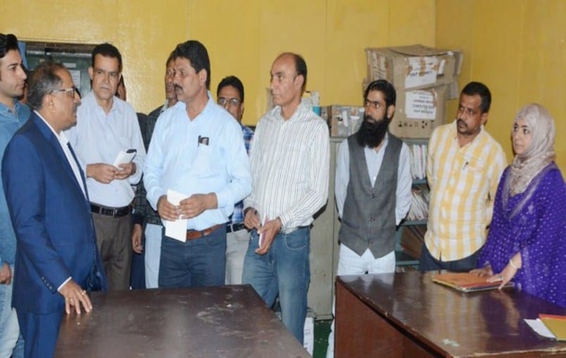 J-K Assembly Speaker interacts with staff