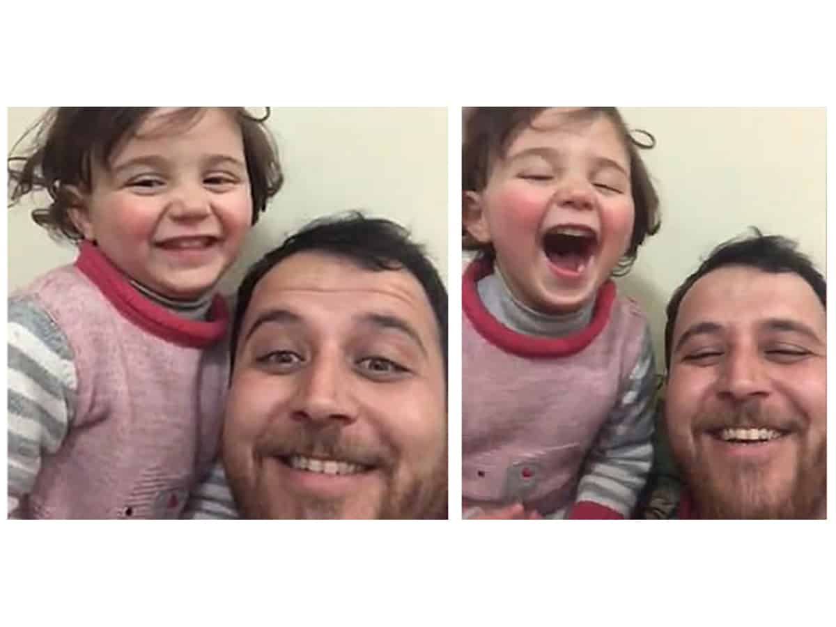 Syrian father teaches tiny daughter to laugh at bomb explosions