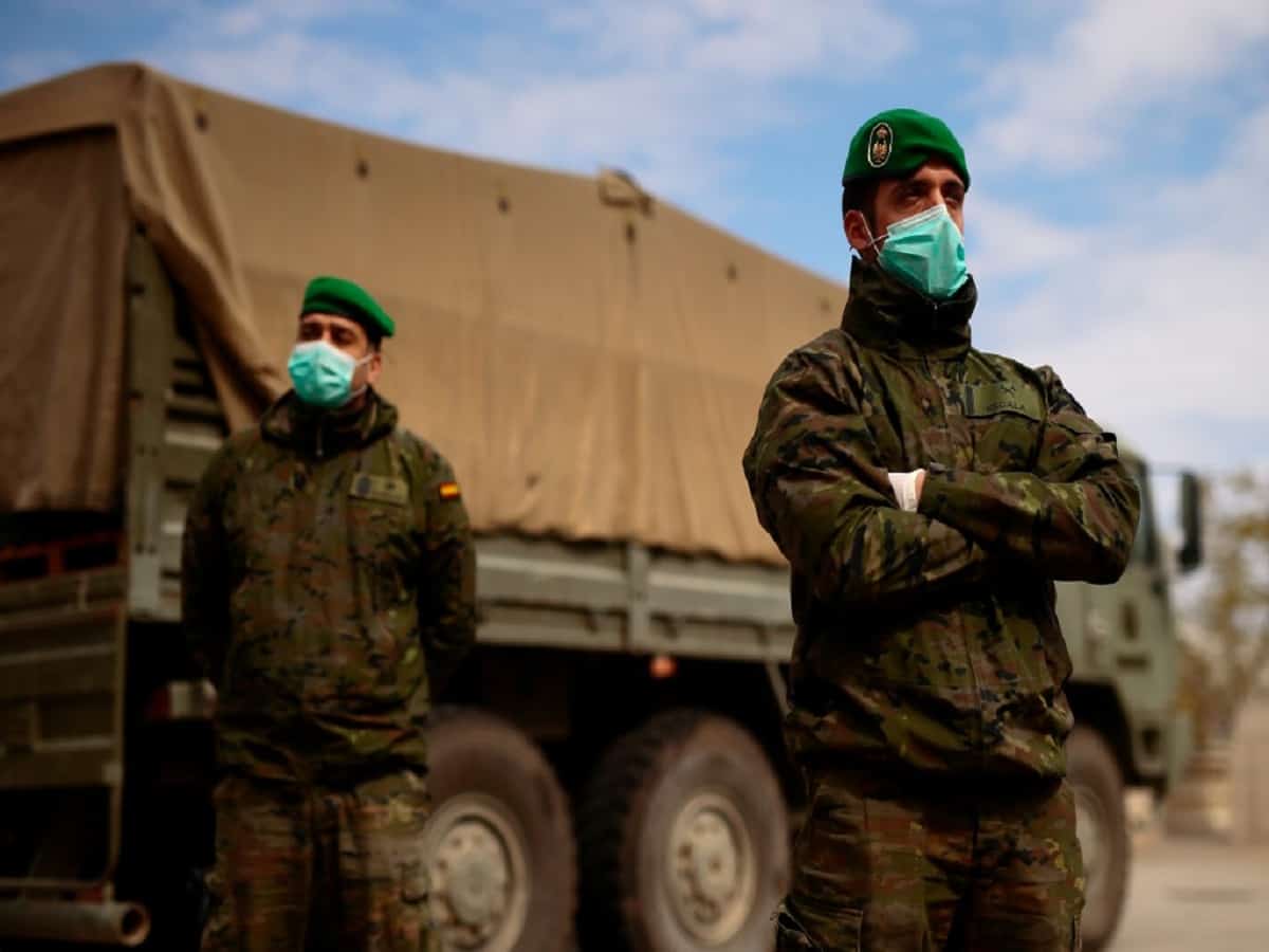 Spanish soldiers stand outside the Fira Barcelona Montjuic centre in Barcelona where a temporary hospital for vulnerable people was set up on March 25, 2020, during the new coronavirus epidemic.