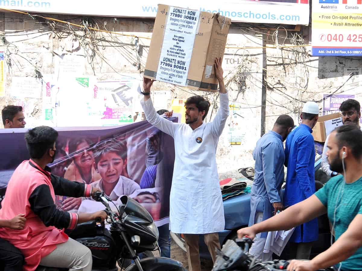 Young men collect donation for Delhi riot victims