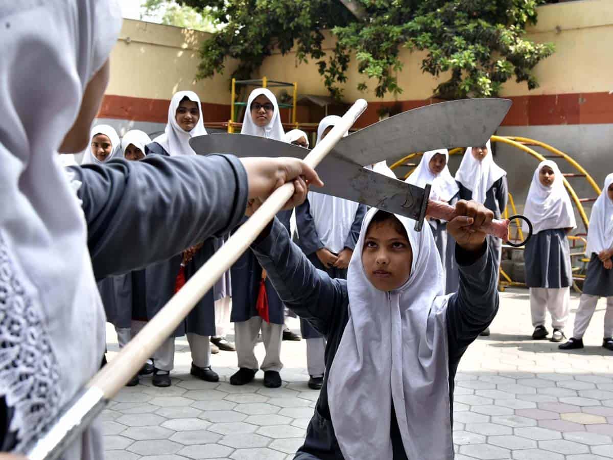 Girl-students display skills in martial arts