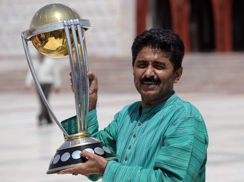 In this file photo taken on September 18, 2014 former Pakistan's cricketer Javed Miandad poses for a photograph with the ICC World Cup 2015 trophy during a ceremony at the mausoleum of the country's founder Mohammad Ali Jinnah in Karachi.