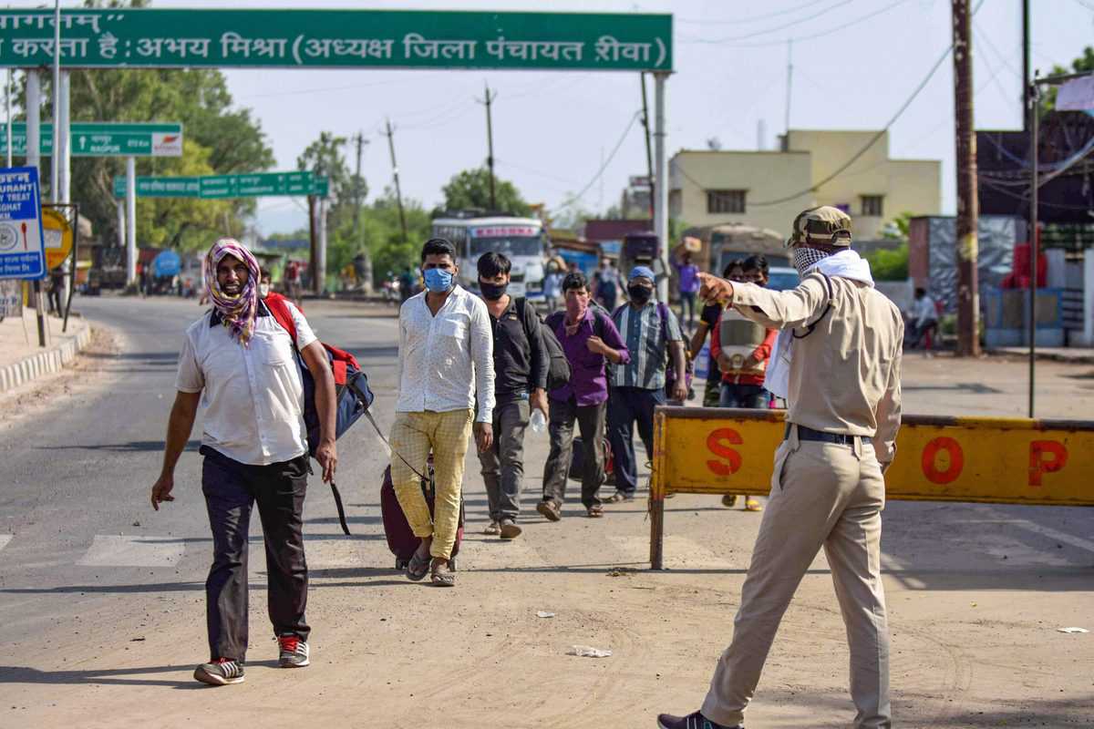 Migrant workers break through the barricades in UP
