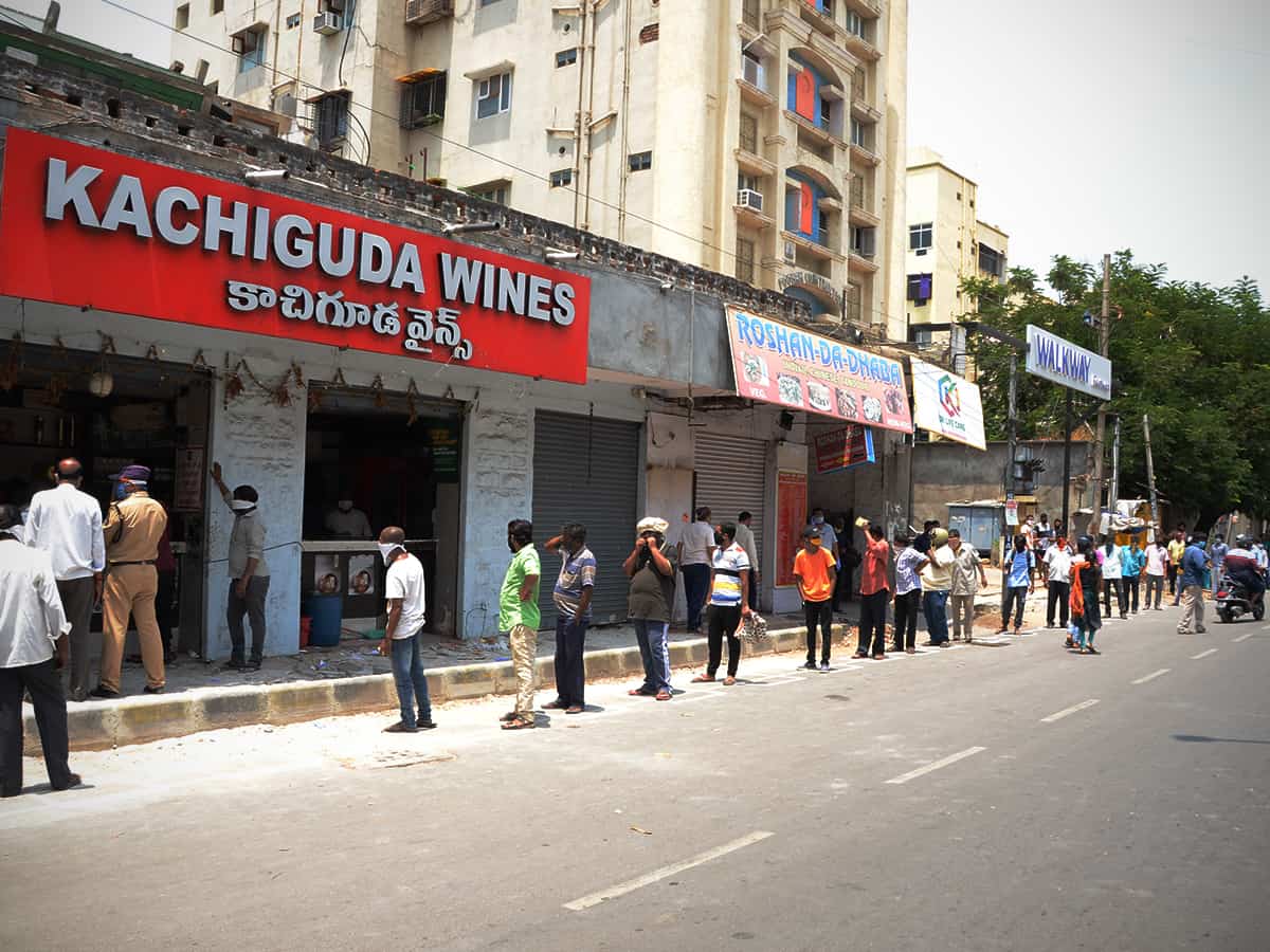 Liquor shops reopen in Telangana, tipplers throng stores