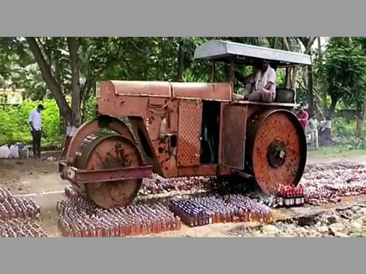 Andhra police destroys liquor worth Rs 72 lakh with a road roller
