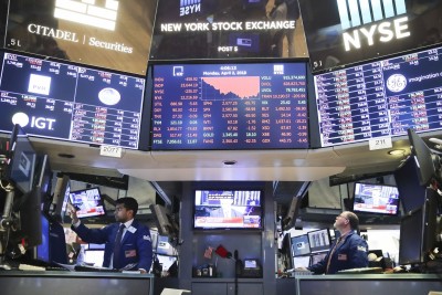 US stocks fall as traders eye earnings, Covid-19 relief package