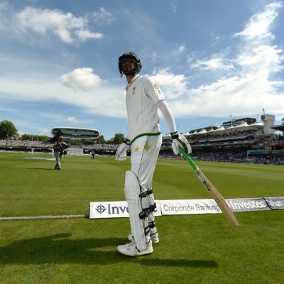 Babar swings momentum in visitors' favour in rain-hit day
