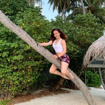 Elli AvrRam turns a flying witch riding the stick on Halloween
