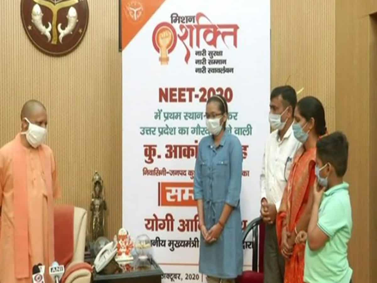 Yogi Adityanath felicitates UP NEET topper Akanksha Singh