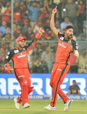 RCB maul listless KKR by eight wickets, go atop