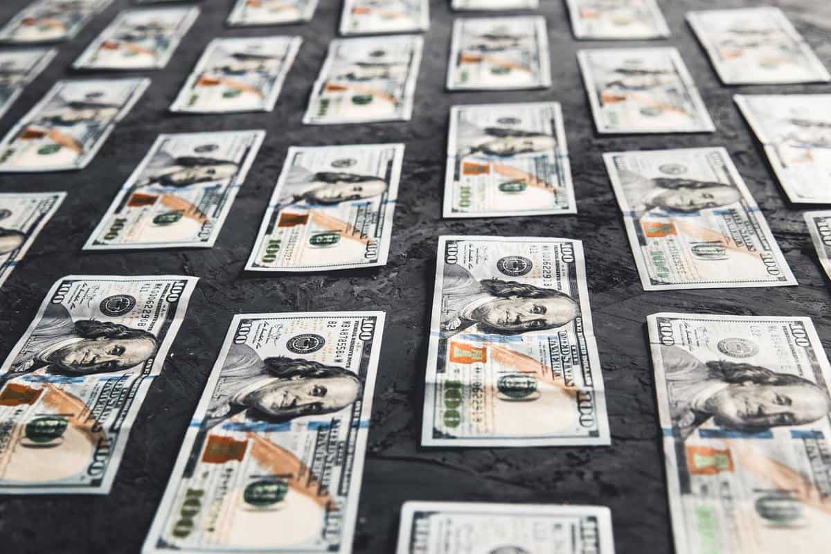 One hundred dollar bills are creatively laid out. Business concept, development perspective