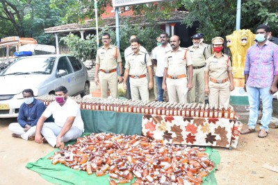 Chittoor police arrest two, seize 1k Karnataka liquor bottles