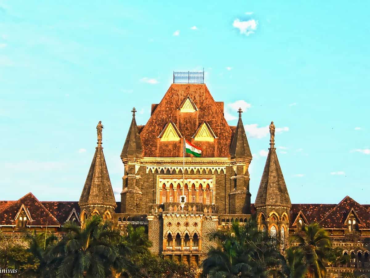 \Moving hand over backof minor without sexual intent is not outraging modesty: Bombay HC