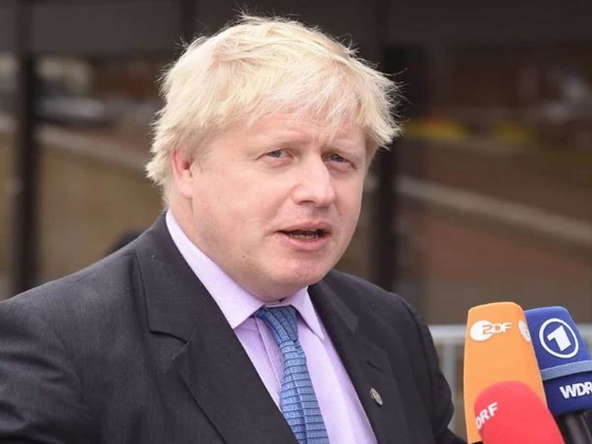 Boris Johnson defends virus record after ex-aide's attack