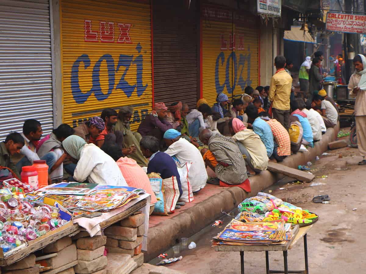 People waiting for charity meal in Varanasi, India