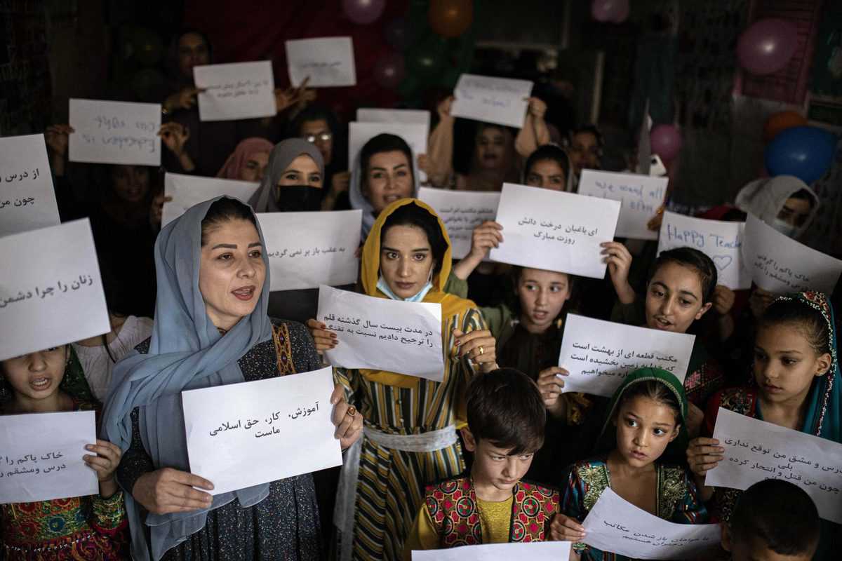 Kabul: Women and teachers demonstrate inside a private school to demand their rights and equal education for women and girls, during a gathering for National Teachers Day, at a private school in Kabul, Afghanistan (AP Photo)