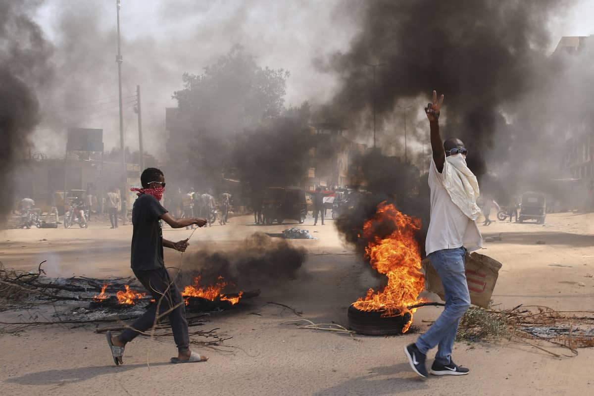 Protesters in Sudan burn tires, block roads a day after coup